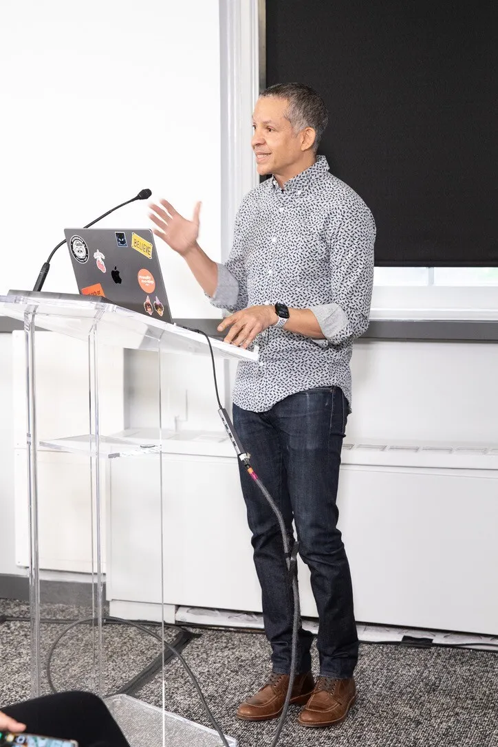Saadiq at the podium running a live agent demo at the New York Public Library