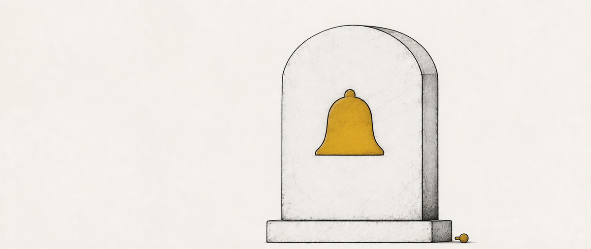 An illustrated headstone bearing a carved ochre notification bell, with the bell's detached clapper resting at its base.